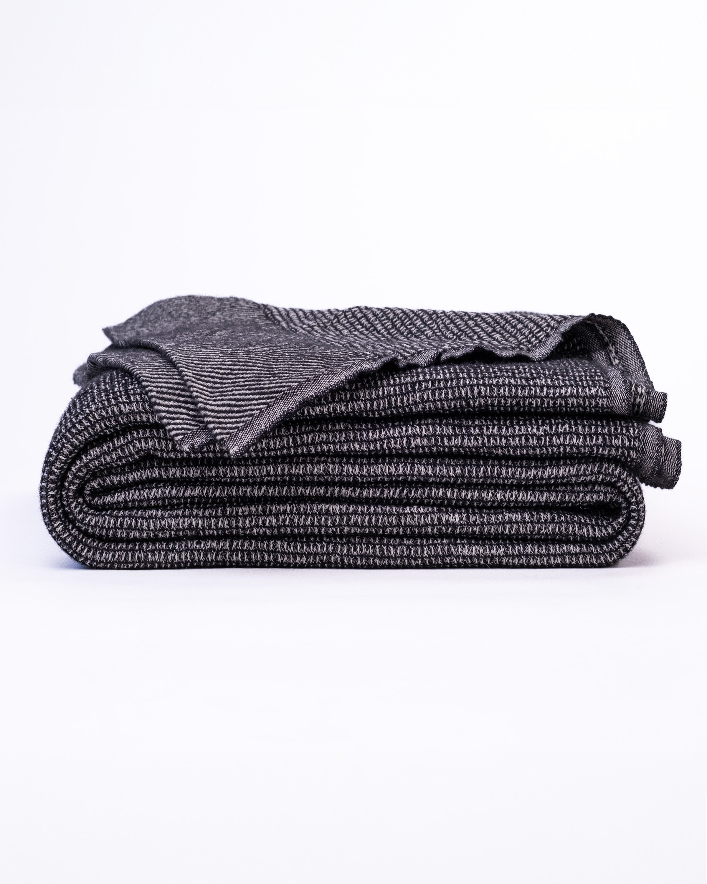 The Micro Waffle Wool Blanket in Charcoal