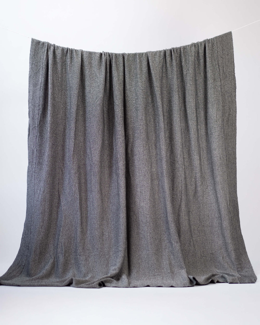 The Micro Waffle Wool Blanket in Charcoal